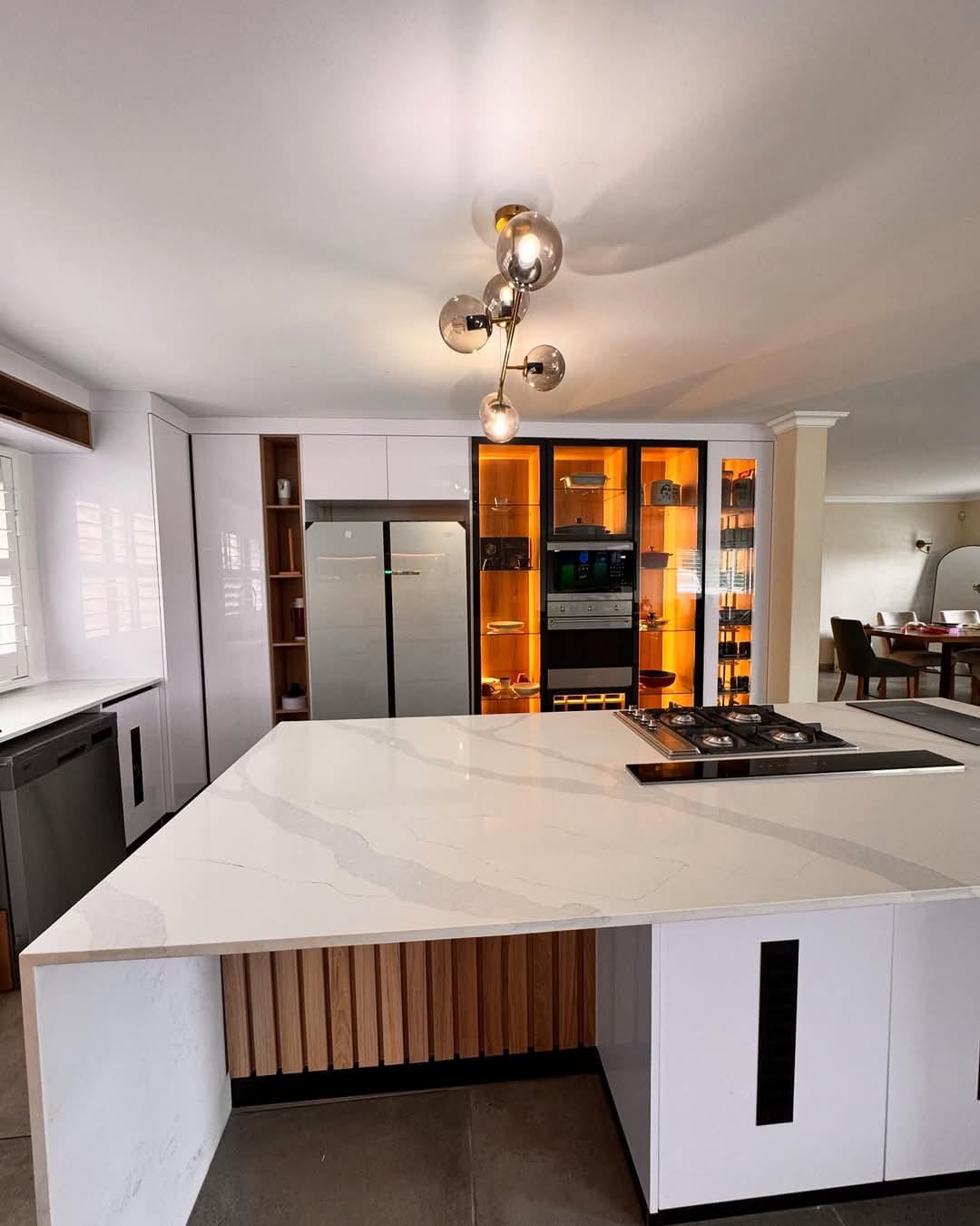 High-gloss white island kitchen